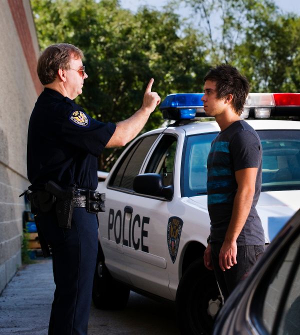 Police officer giving man roadside DUI test