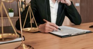 lawyer sitting at table reviewing documents