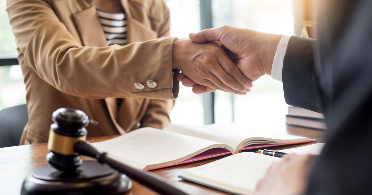 Lawyer and client shaking hands